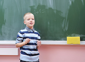 Image showing happy young boy at first grade math classes 