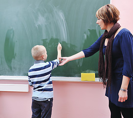 Image showing happy young boy at first grade math classes 