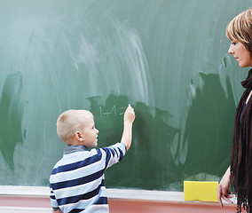 Image showing happy young boy at first grade math classes 