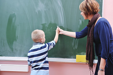 Image showing happy young boy at first grade math classes 