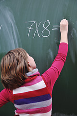 Image showing happy school girl on math classes