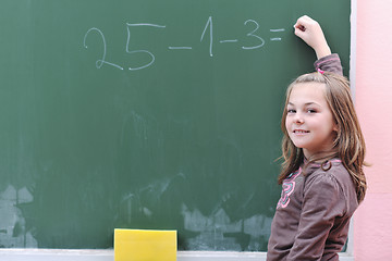 Image showing happy school girl on math classes