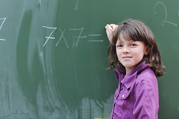 Image showing happy school girl on math classes