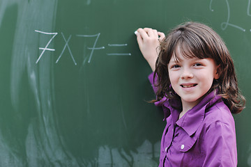 Image showing happy school girl on math classes