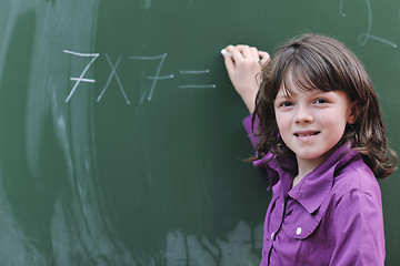 Image showing happy school girl on math classes