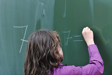 Image showing happy school girl on math classes