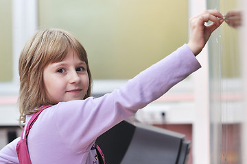 Image showing happy school girl on math classes