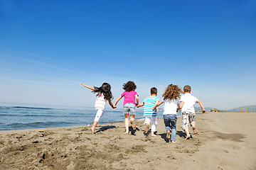 Image showing happy child group playing  on beach