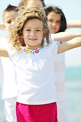 Image showing happy child group playing  on beach