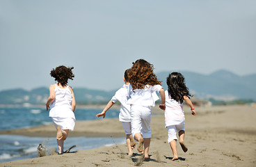 Image showing happy child group playing  on beach