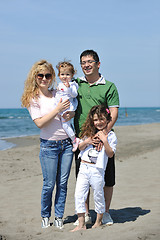 Image showing happy young family have fun on beach