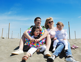 Image showing happy young family have fun on beach