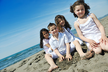 Image showing happy child group playing  on beach