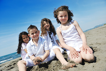 Image showing happy child group playing  on beach