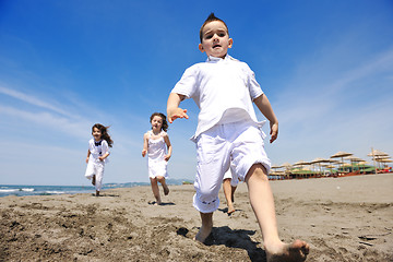 Image showing happy child group playing  on beach