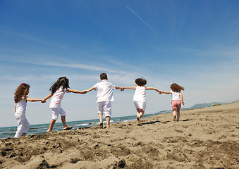 Image showing happy child group playing  on beach