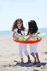 Image showing happy child group playing  on beach