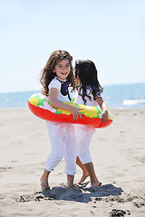 Image showing happy child group playing  on beach