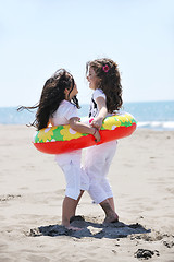 Image showing happy child group playing  on beach