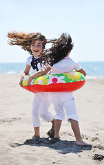 Image showing happy child group playing  on beach