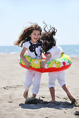 Image showing happy child group playing  on beach