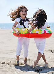 Image showing happy child group playing  on beach