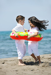 Image showing happy child group playing  on beach