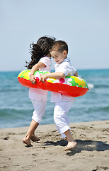 Image showing happy child group playing  on beach