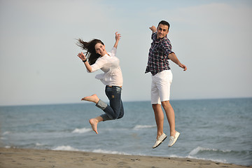 Image showing happy young couple have fun on beach