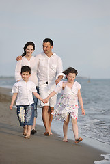 Image showing happy young family have fun on beach