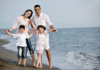 Image showing happy young family have fun on beach