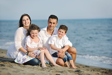 Image showing happy young family have fun on beach