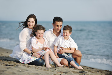 Image showing happy young family have fun on beach