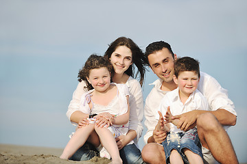 Image showing happy young family have fun on beach