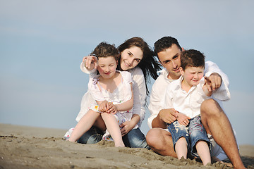 Image showing happy young family have fun on beach