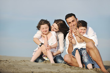 Image showing happy young family have fun on beach