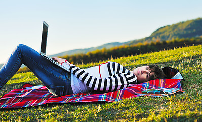 Image showing young teen girl work on laptop outdoor