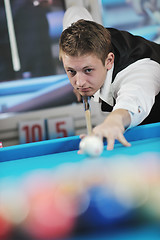 Image showing young man play pro billiard game 