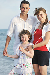 Image showing happy young family have fun on beach