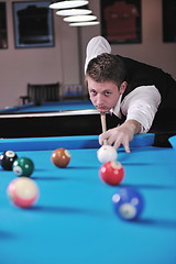 Image showing young man play pro billiard game 