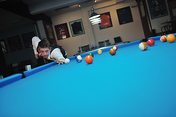 Image showing young man play pro billiard game 