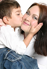 Image showing Child giving mother a kiss