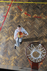 Image showing businessman holding basketball ball