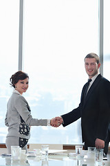 Image showing business man and woman handshake on  meeting