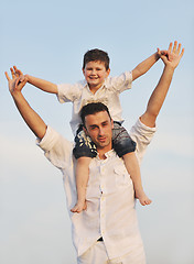 Image showing happy young family have fun on beach