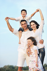 Image showing happy young family have fun on beach