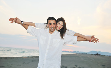 Image showing happy young couple have fun on beach