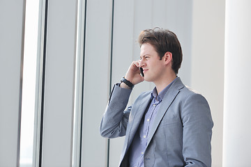 Image showing young business man talk by cellphone