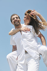 Image showing happy young couple have fun on beach