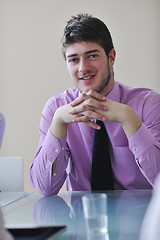 Image showing young business man alone in conference room